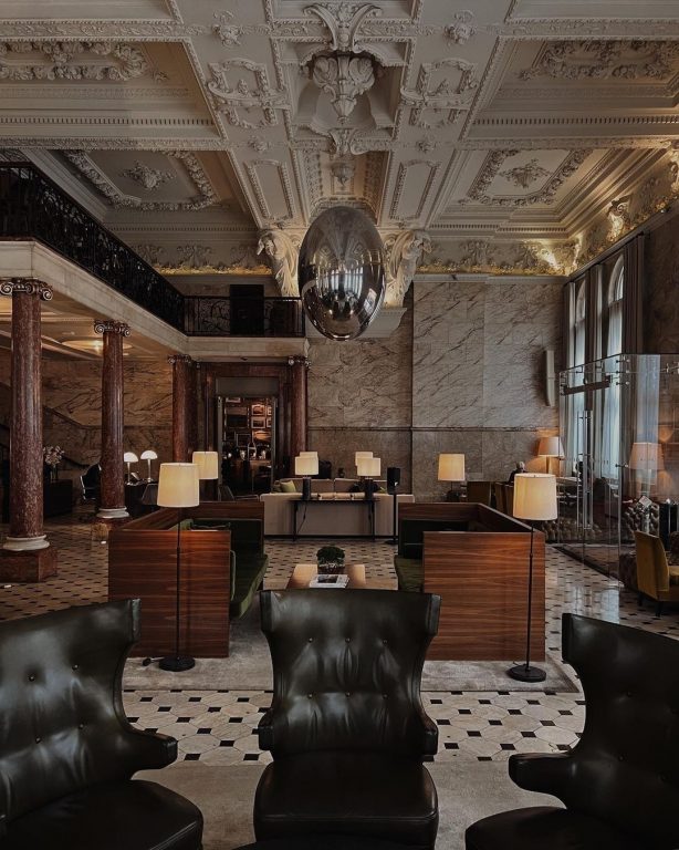 Berners Tavern beneath its ornate gallery-hung ceiling, set for dinner