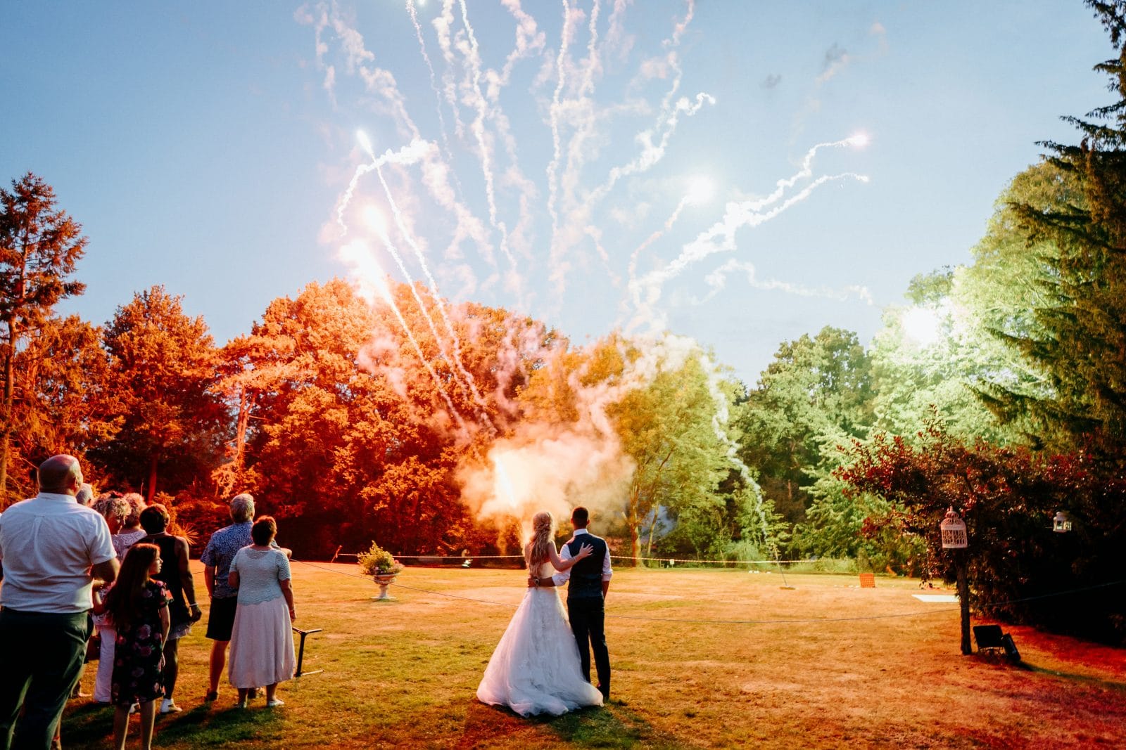 Fireworks over the lawn at Creeksea Place, guests watching
