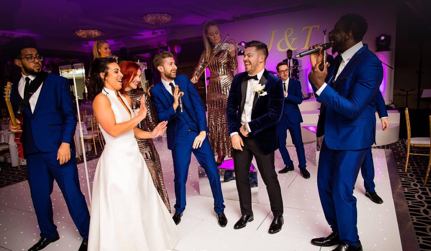 The Function Band with the bride and groom on the dance floor