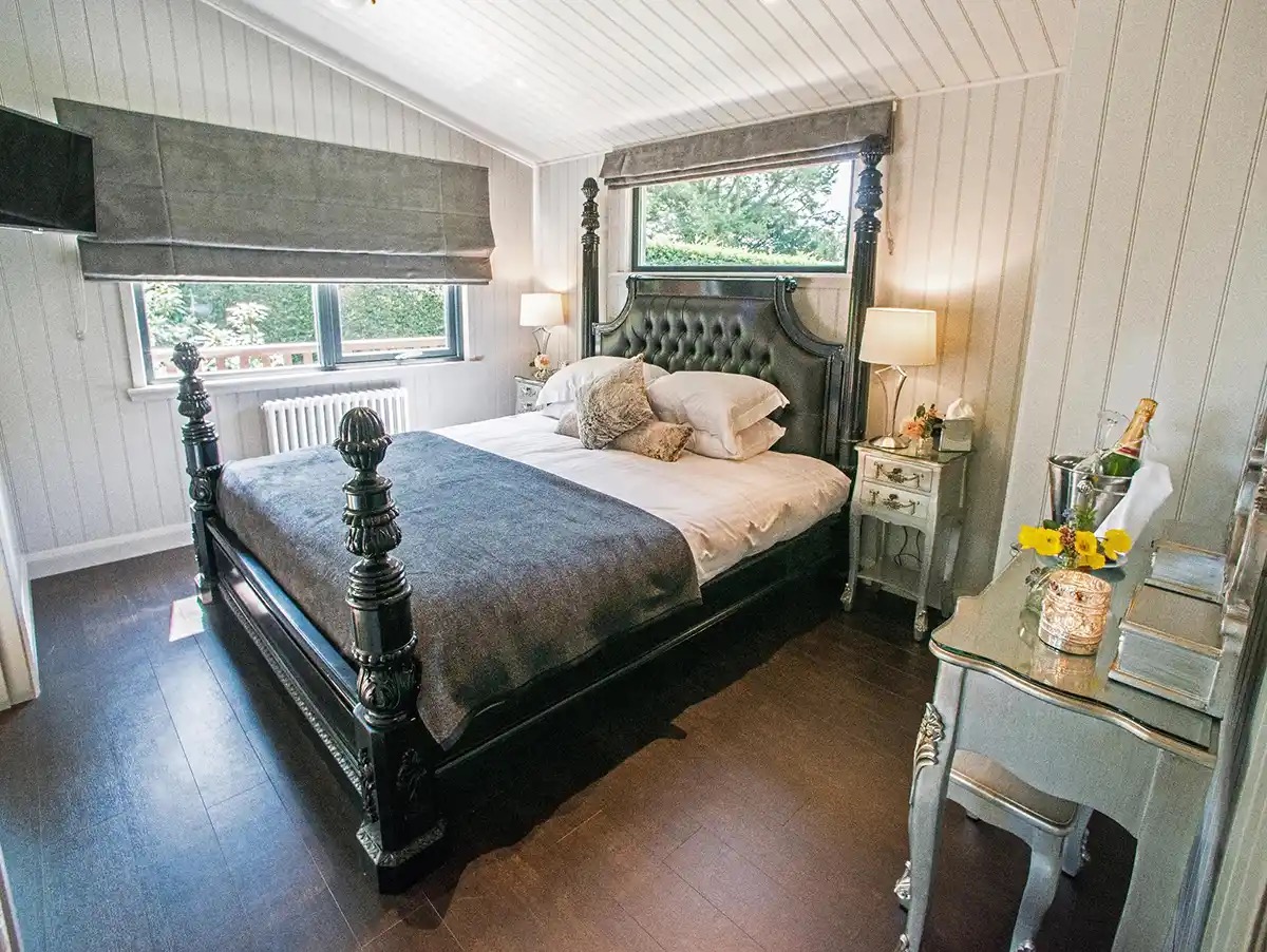 The Retreat, the honeymoon room, a dark four-poster and panelled walls