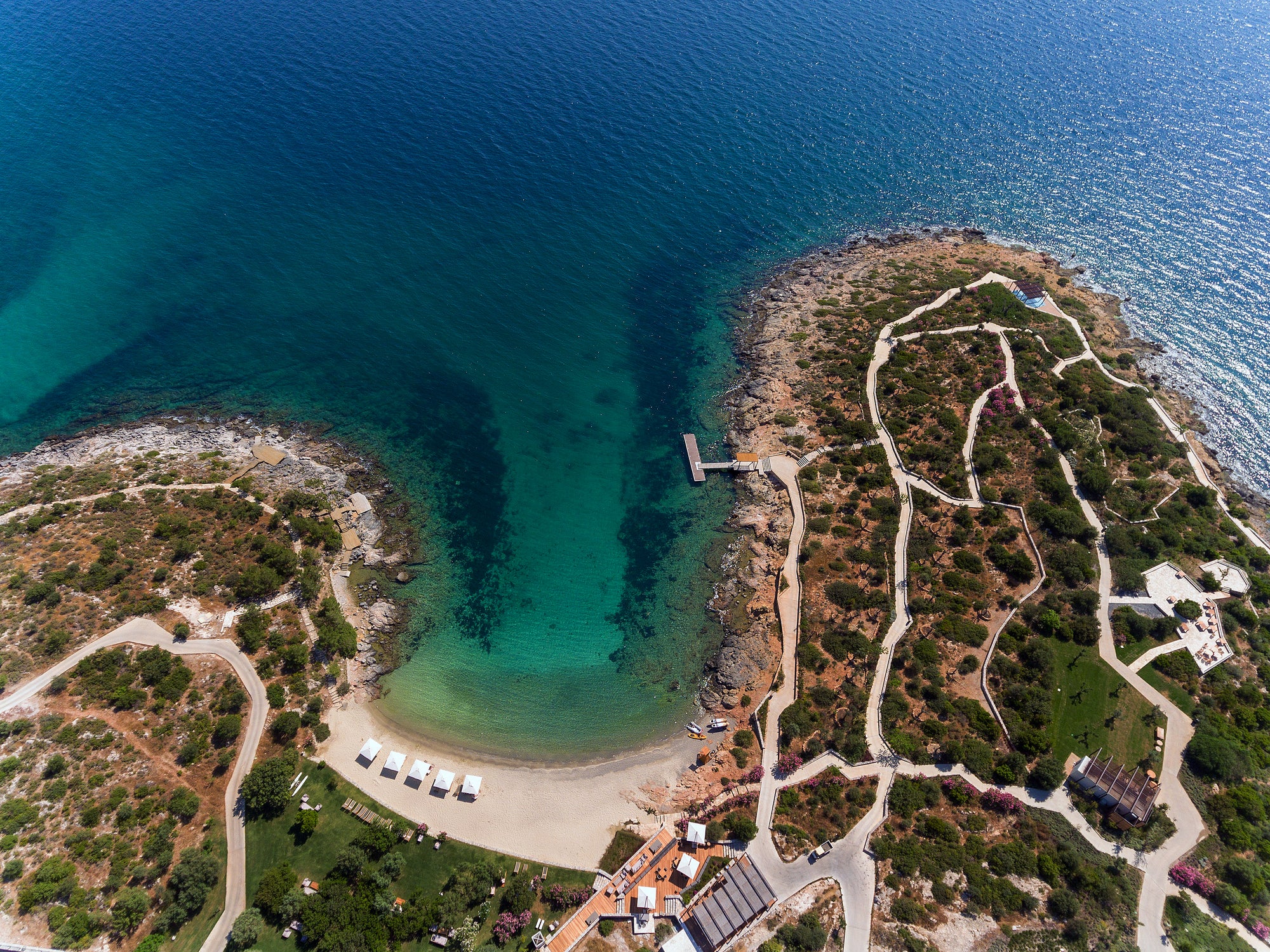Aerial view of a rocky cove and headland along the coastline
