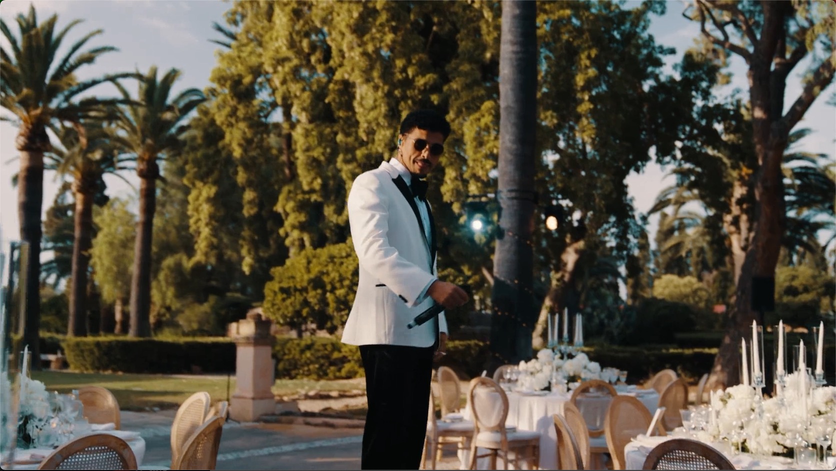 Vocalist performing at an elegant outdoor luxury dinner