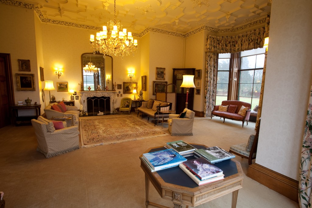 A castle bedroom with a floral four-poster bed