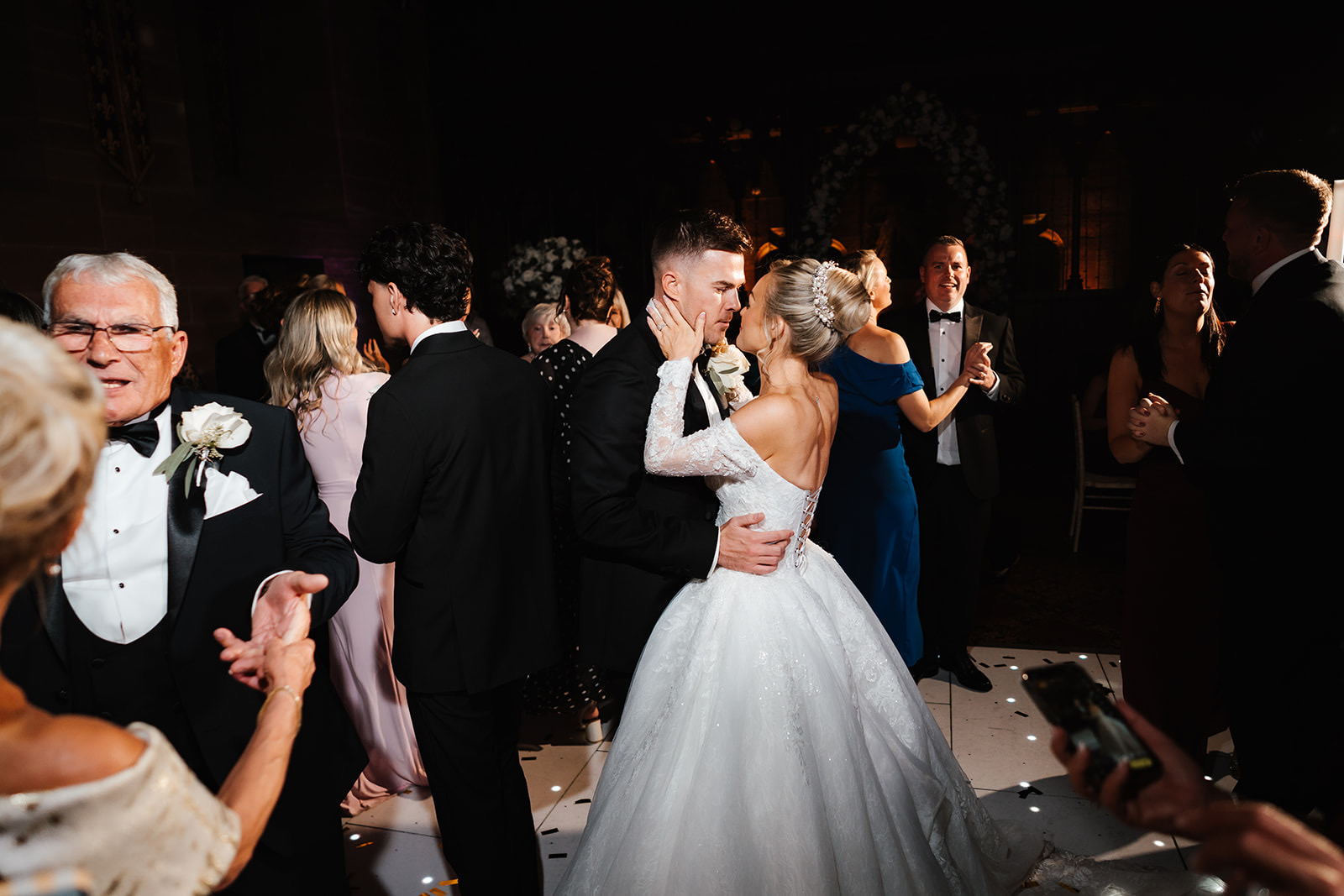 The couple's first dance on a sparkling dancefloor at night