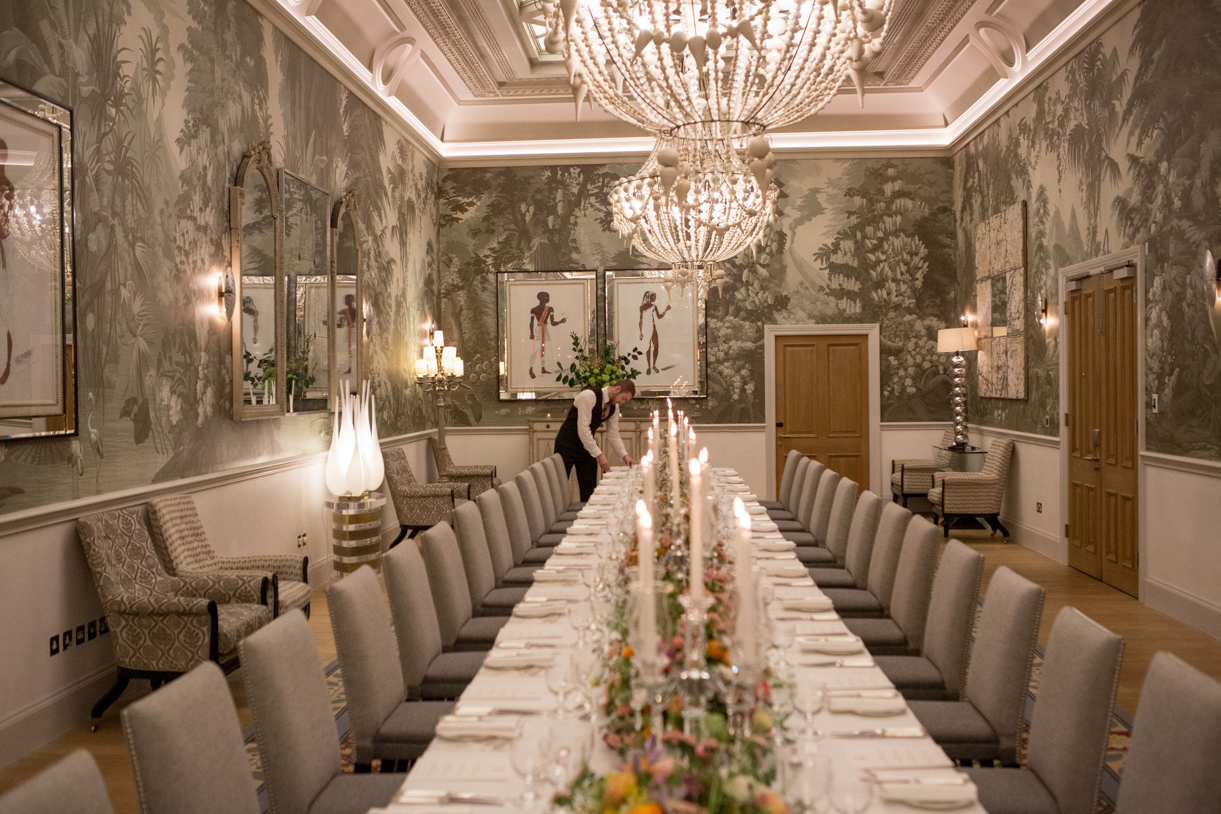 The Shooting Gallery, a wide long table with flowers and candles