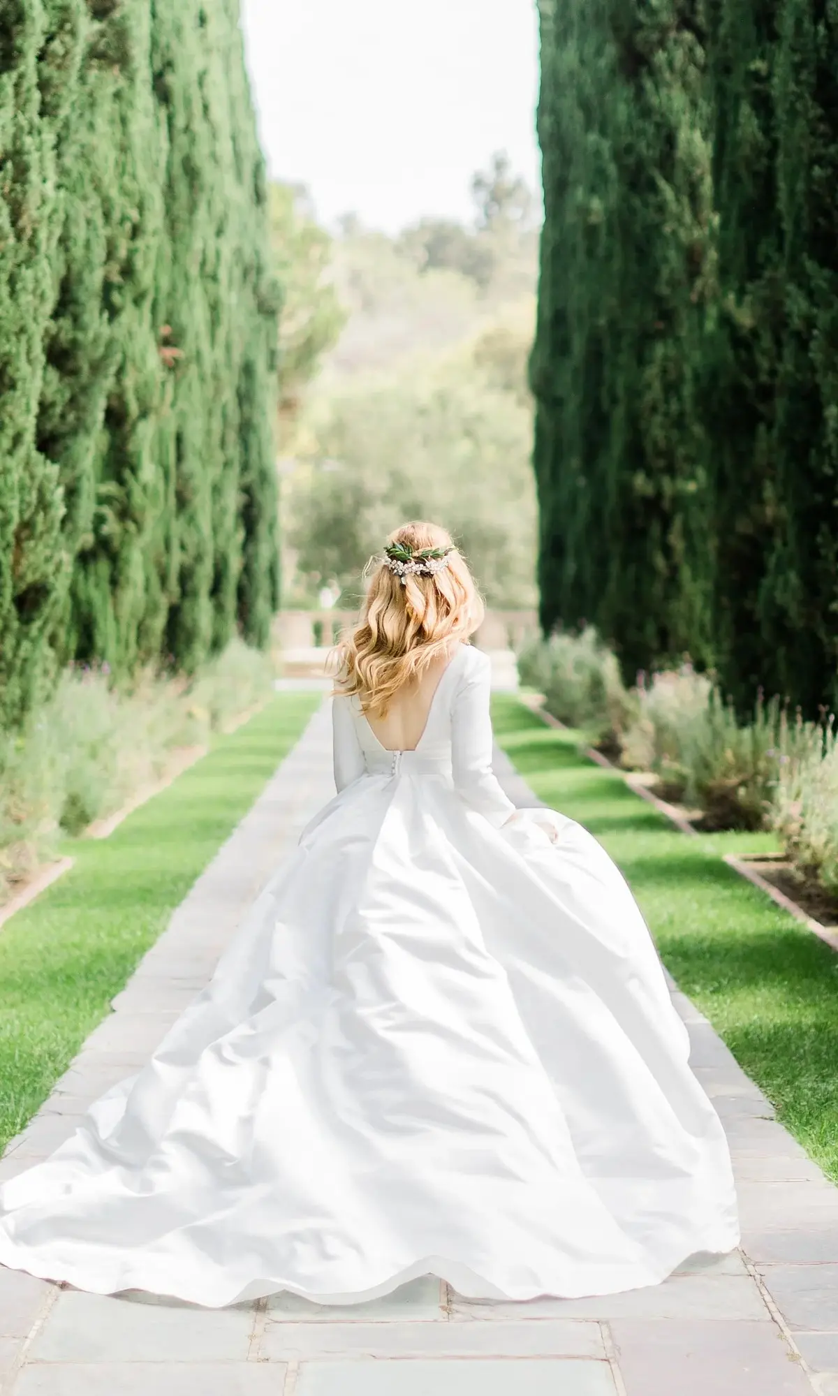 A bride in the cypress allee at Greystone Mansion