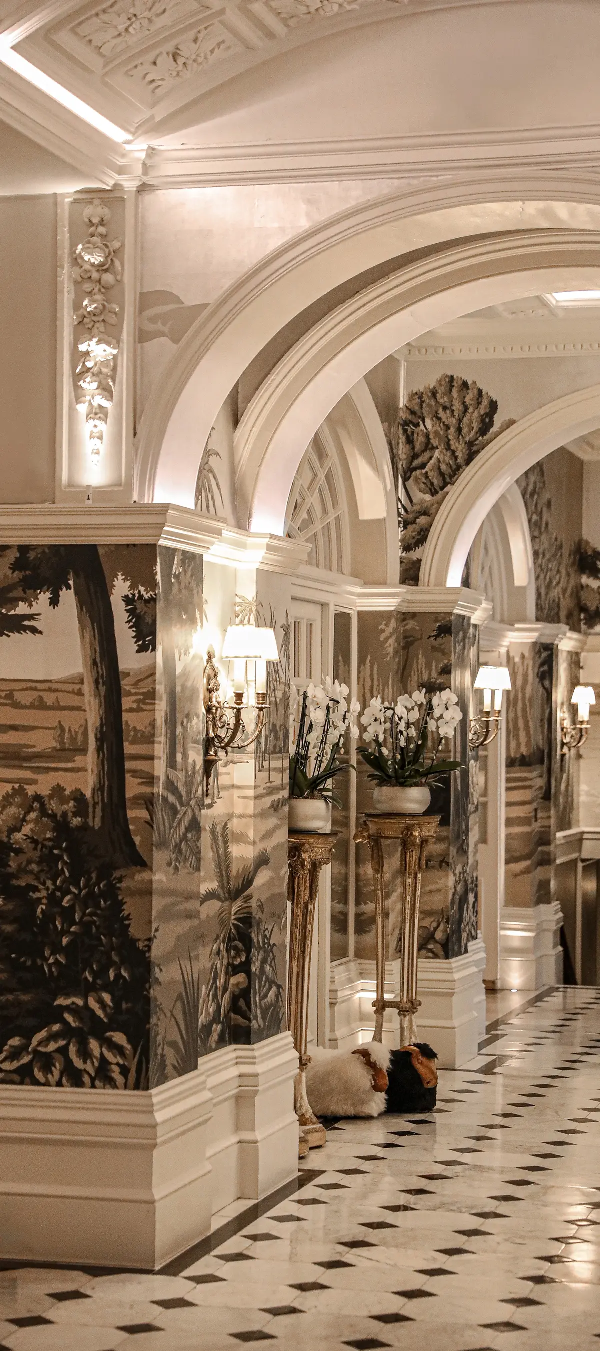 The Front Hall, chinoiserie murals and a chequerboard marble floor
