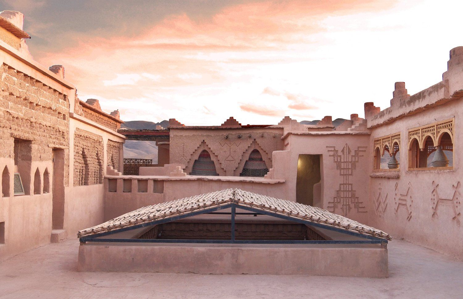 The glass-roofed courtyard, set for a celebration
