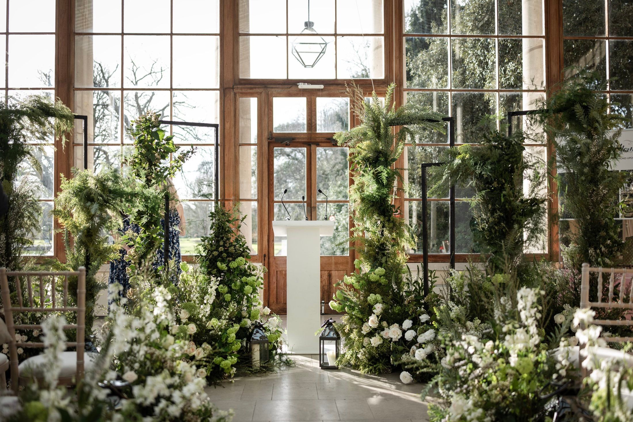 A pared-back white and green showcase aisle, Kew Gardens