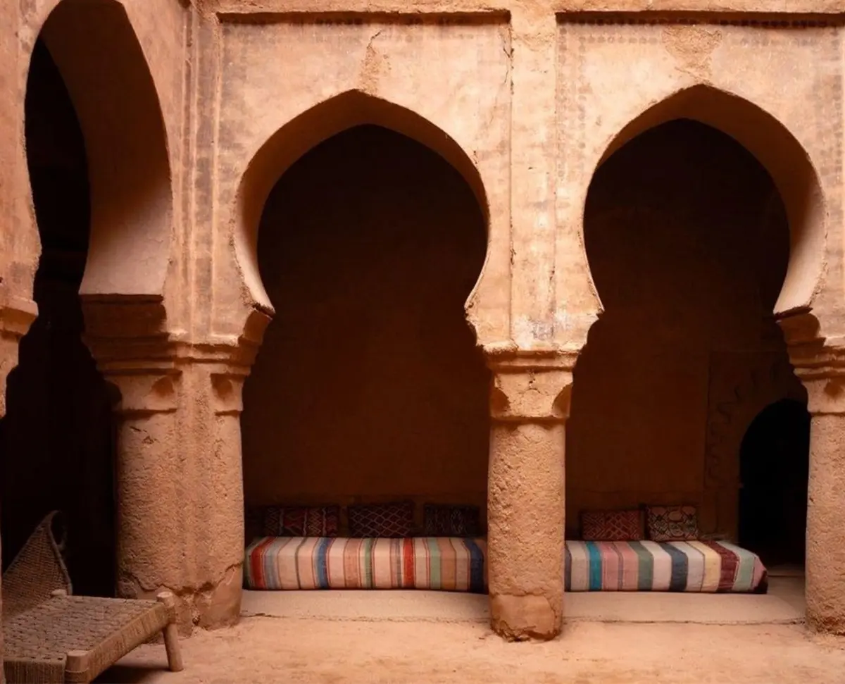 A courtyard of keyhole arches, with banquettes