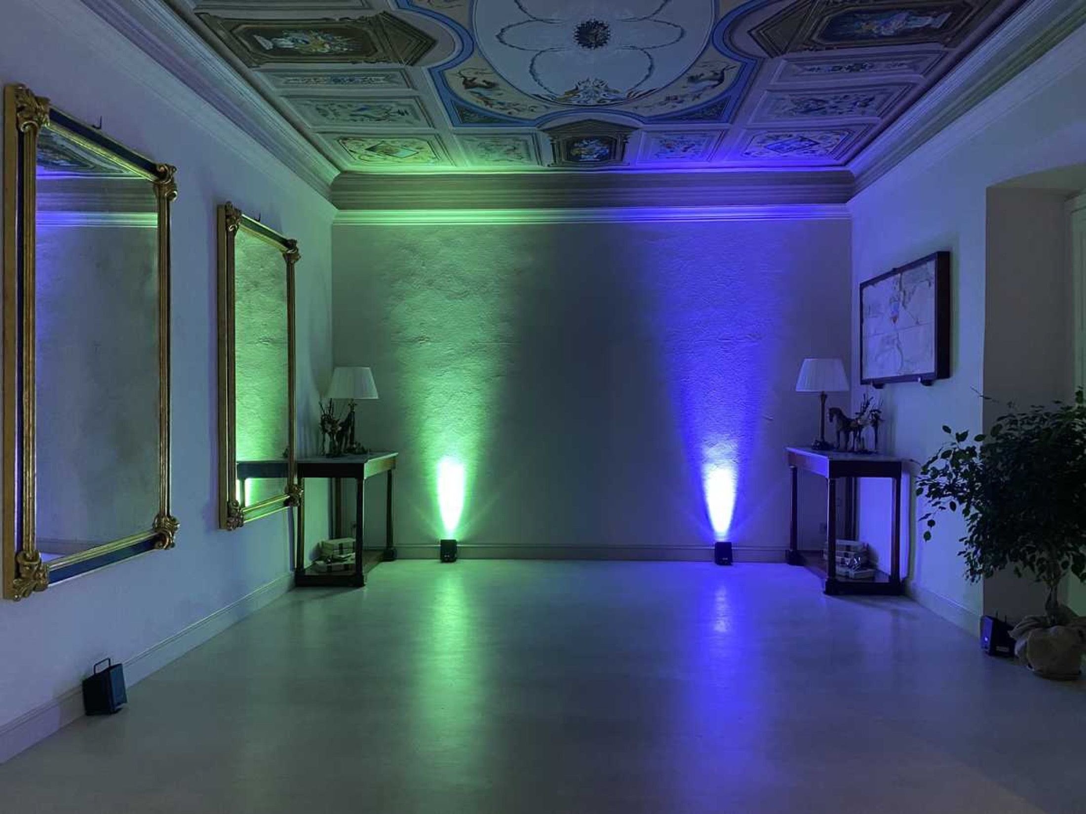 A frescoed salon lit for the evening