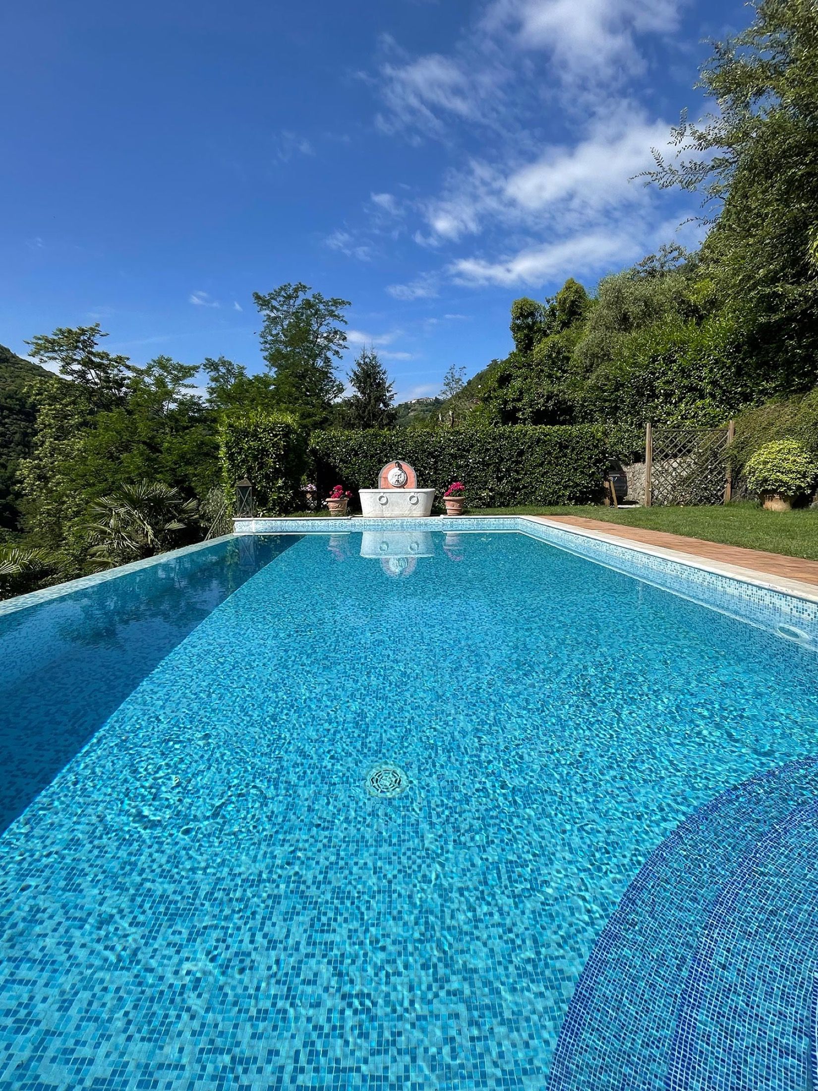 The infinity pool, framed by the Tuscan hills