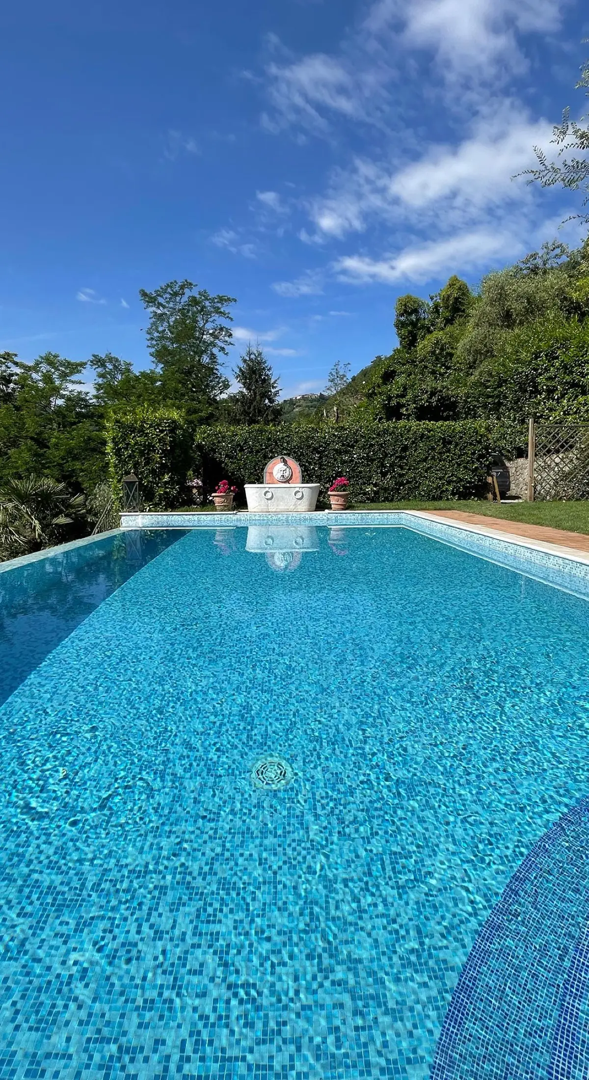 The infinity pool, framed by the Tuscan hills