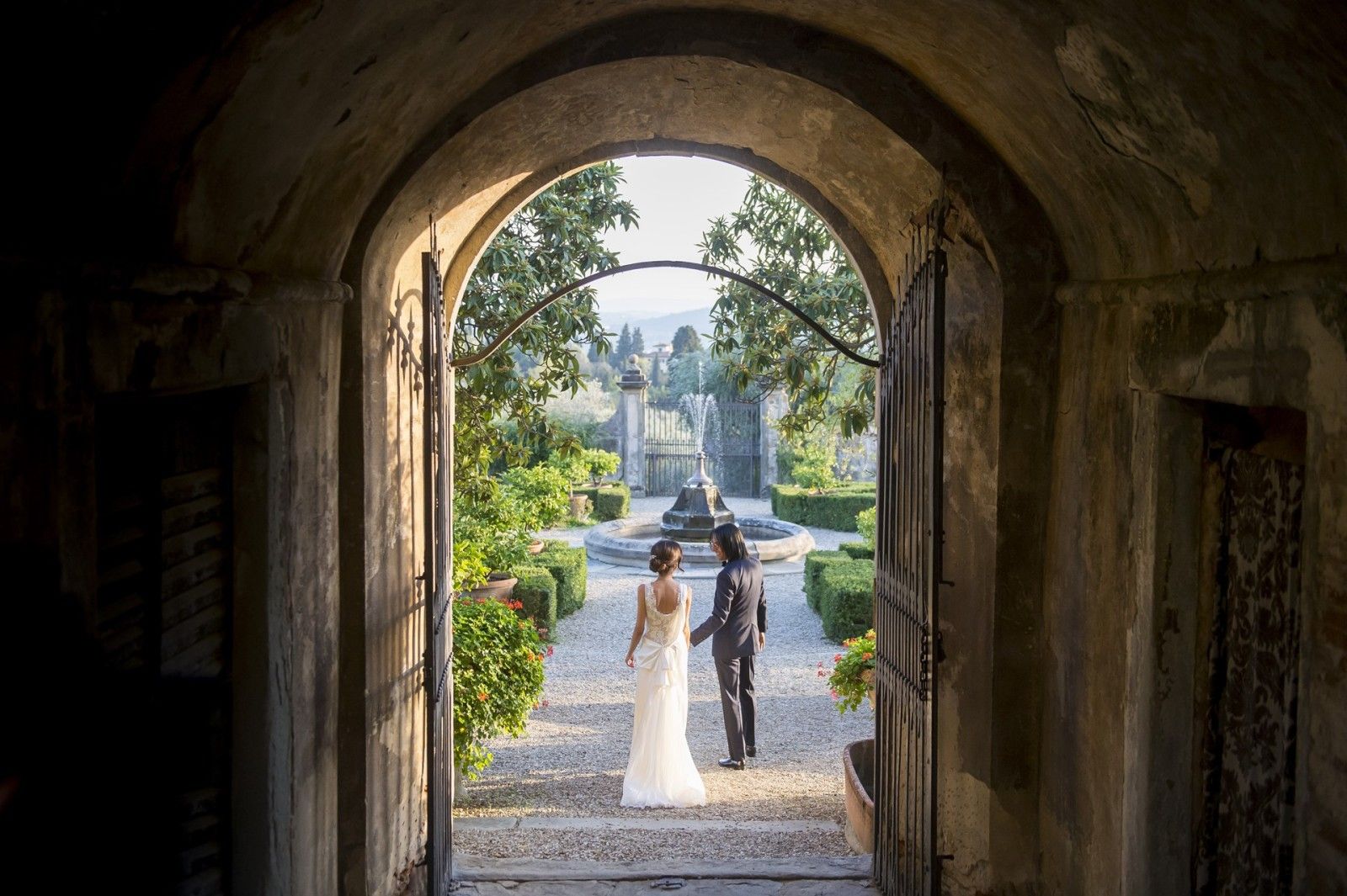 Through the arch into the formal garden, walking towards the fountain