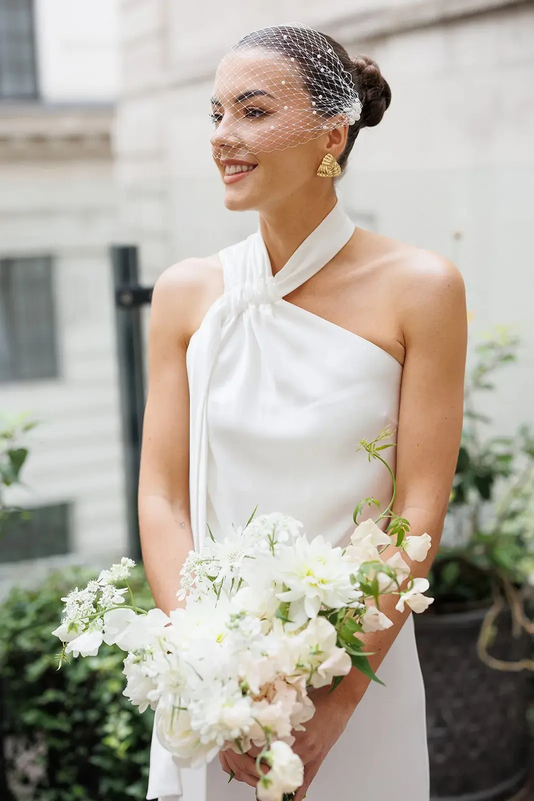 Emily's bridal portrait, a bouquet of white and cream blooms, The Ned, Sweet Pea Floral Design, Hackney, England