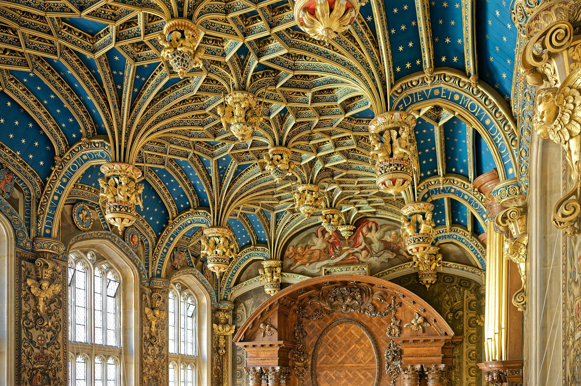 The Chapel Royal's vaulted ceiling, deep blue studded with gold stars and gilded pendants, Hampton Court Palace, East Molesey, England