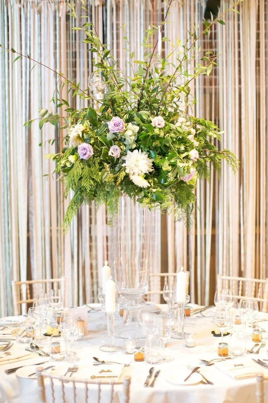 A tall centrepiece on a mirrored plinth, the Gaynes Park reception