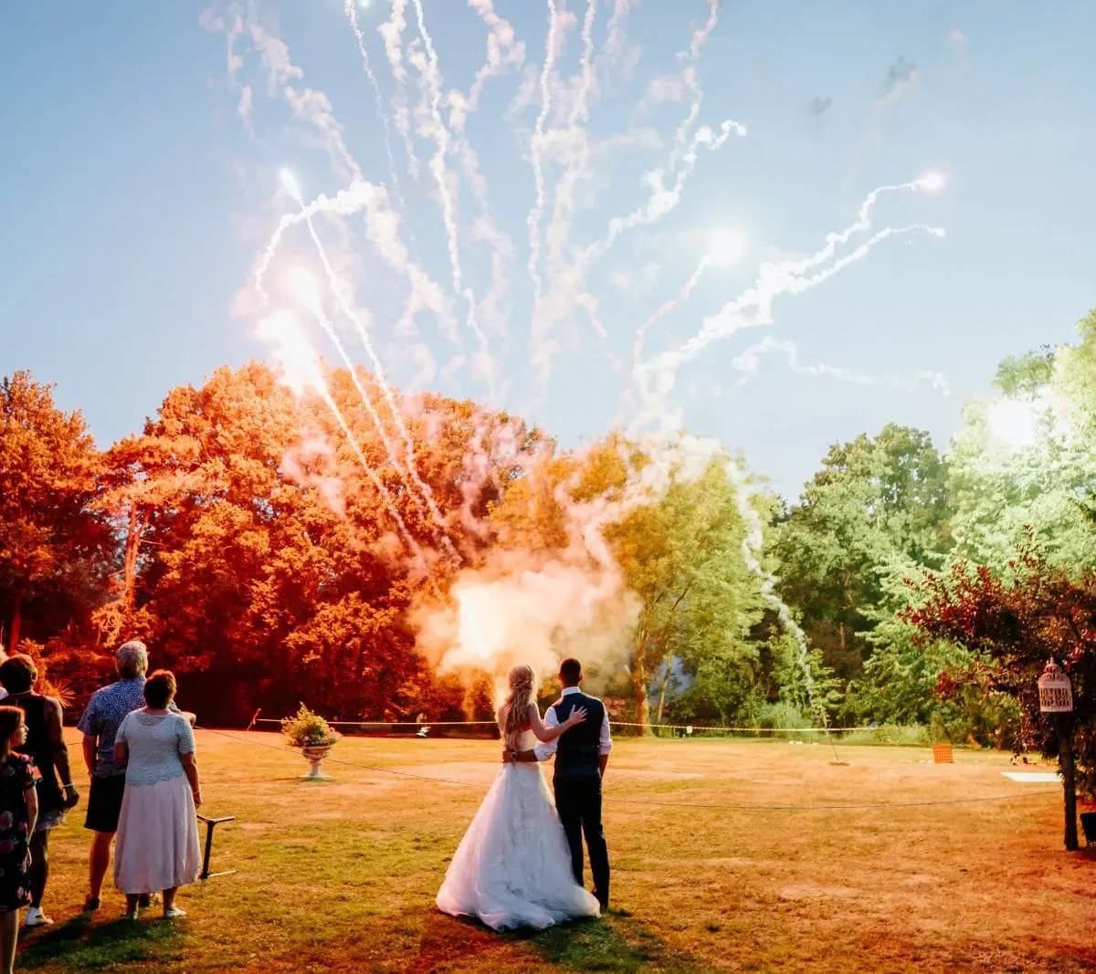 Fireworks over the lawn at Creeksea Place, guests watching