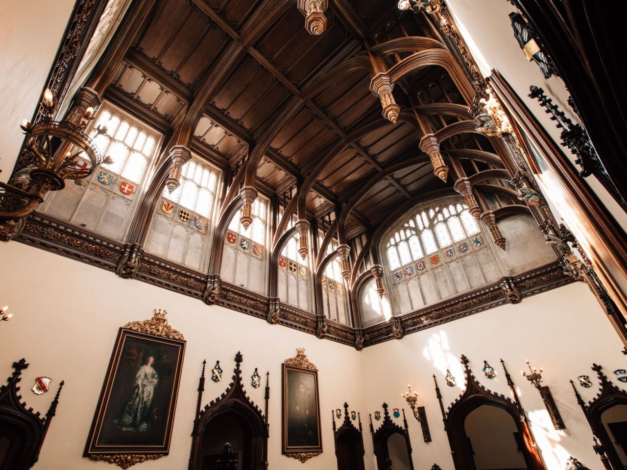 The Great Hall roof, carved hammer beams and stained-glass windows