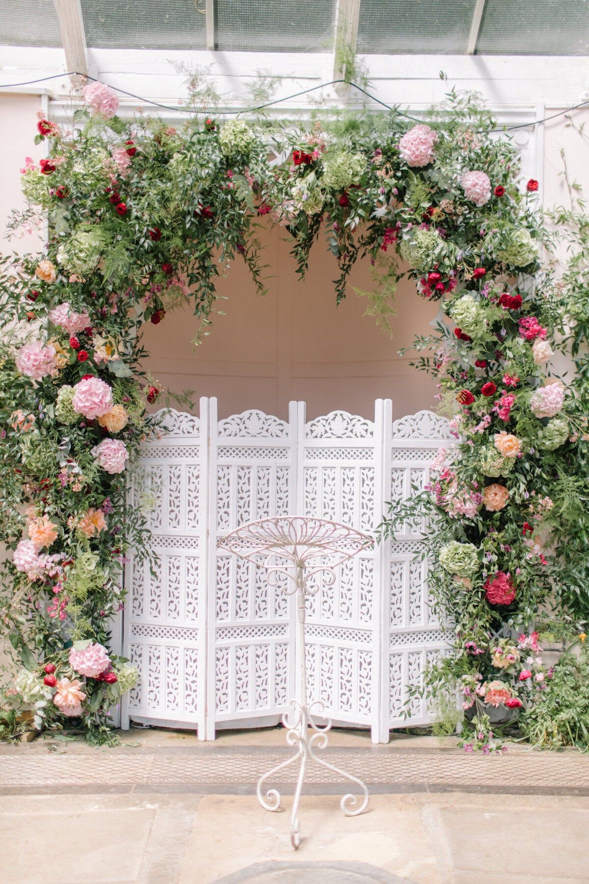 A floral archway, a wedding at Sezincote