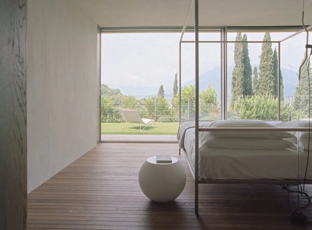 A bedroom suite open to the cypress and the lake