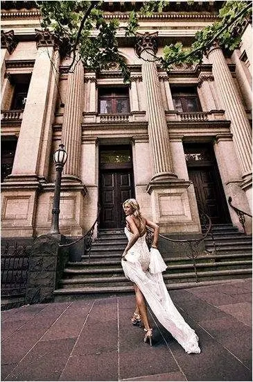 Running down the steps outside the old bank, silk catching the wind, Yervant International Photography, South Melbourne, Australia