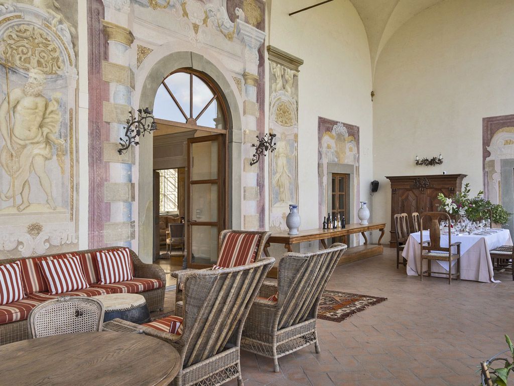 The frescoed Renaissance loggia interior open to the Chianti hills, Villa Mangiacane, Tuscany