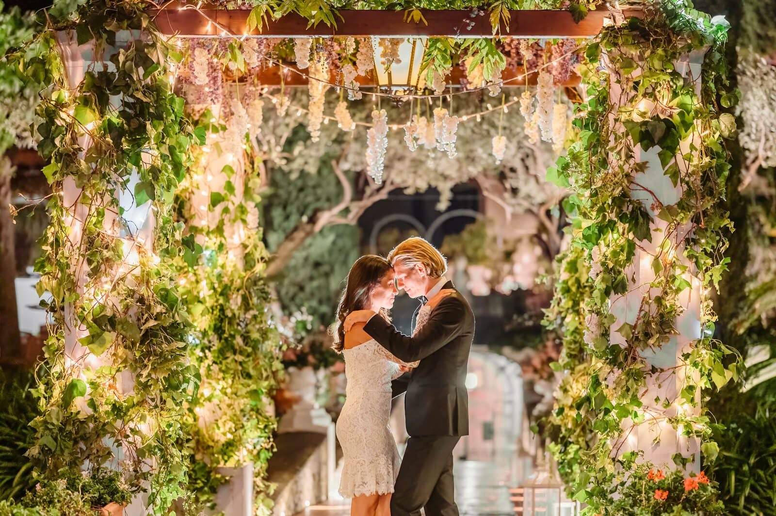 The first dance under a floral pergola on the Amalfi Coast