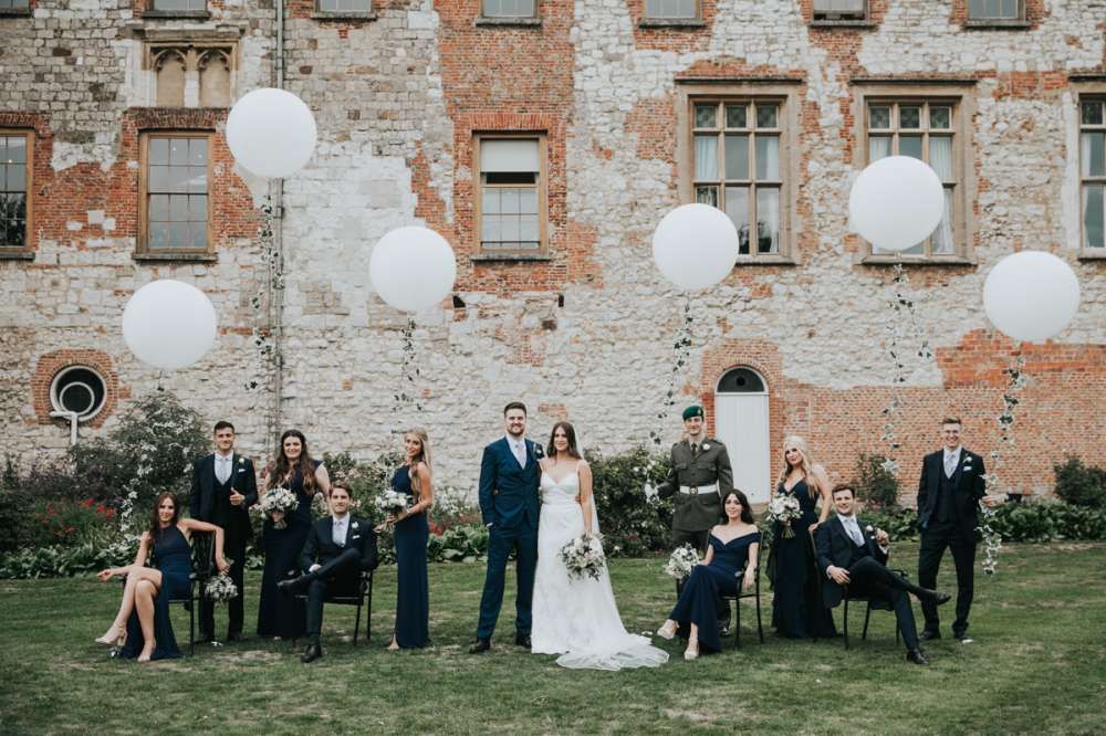 The wedding party gathered before the castle walls
