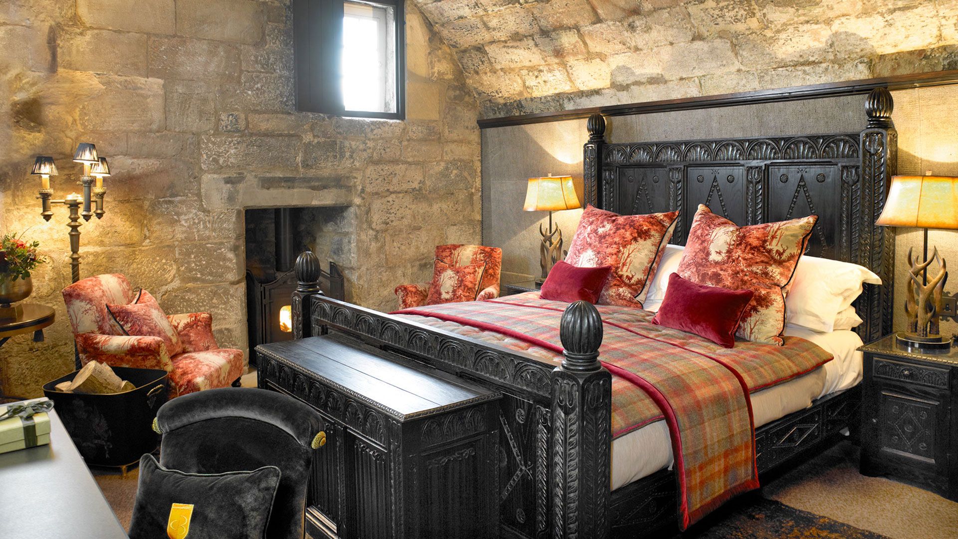 A tower bedchamber, a four-poster in bare stone