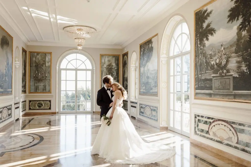A couple in a frescoed Roman palazzo