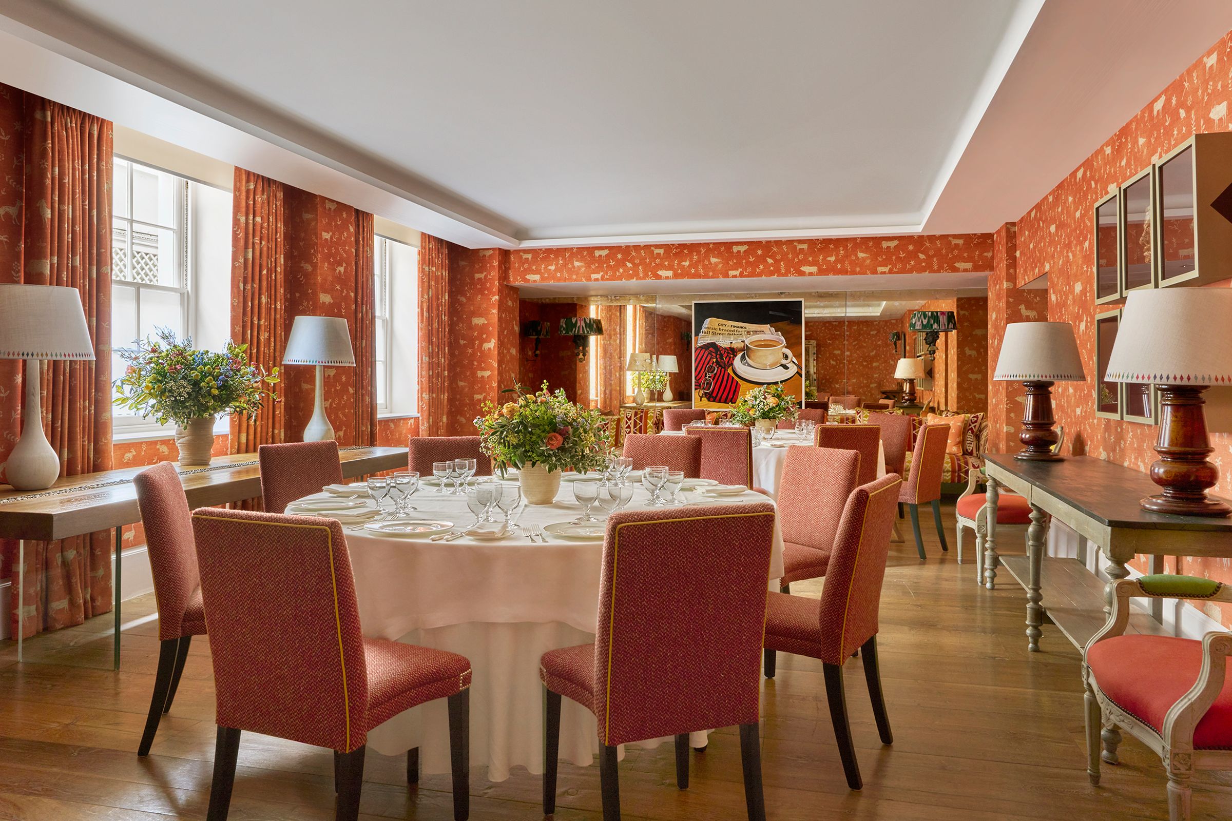The Rocklin Room, two round tables against exposed brick