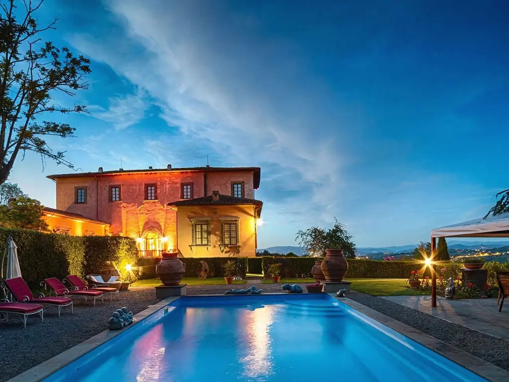 The outdoor pool at Villa Mangiacane by night