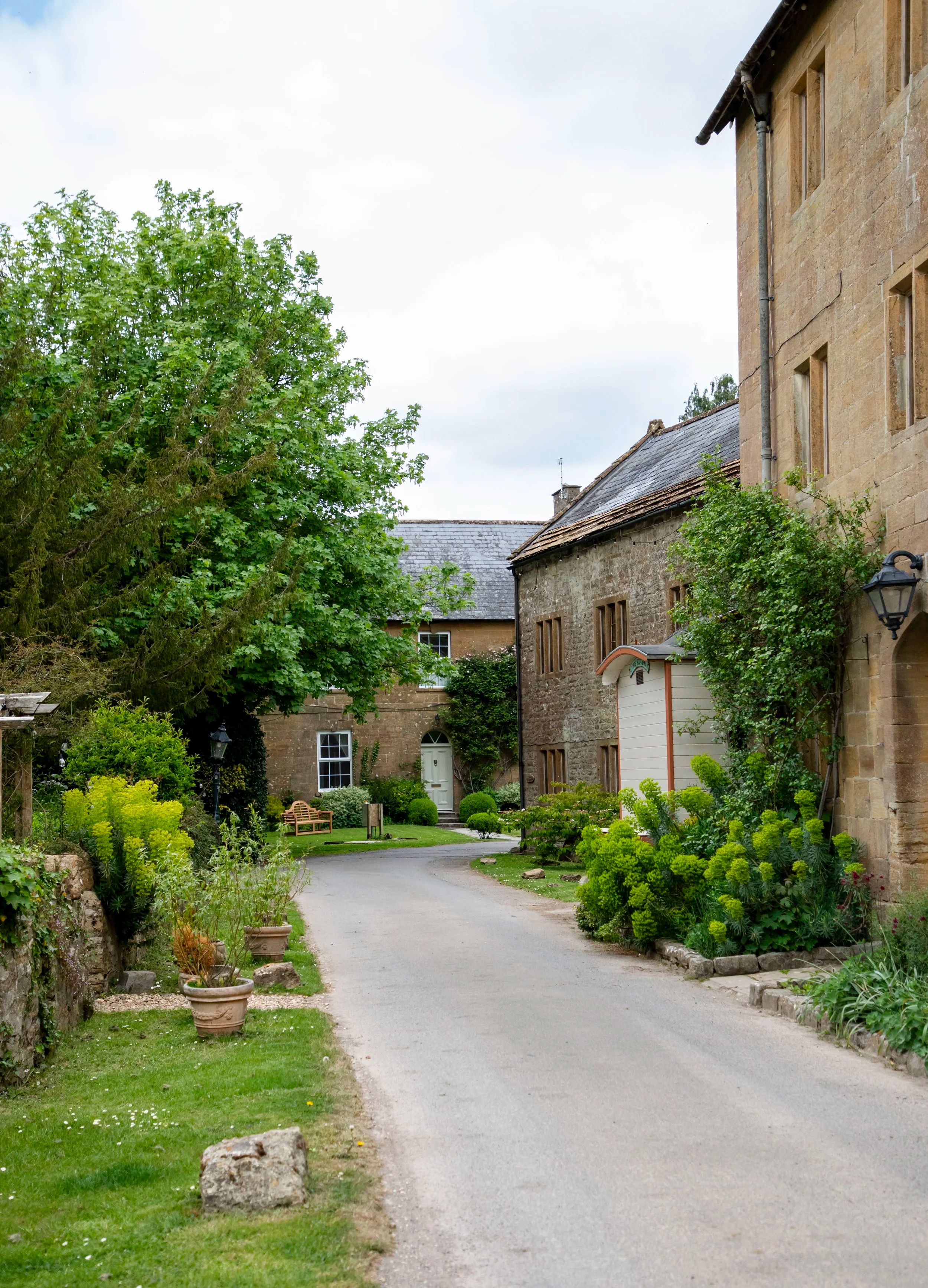 The estate lane between the hamstone buildings