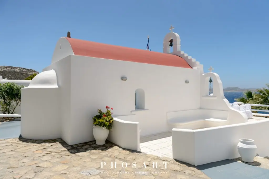 A Chapel, a Bay, and the Island of Delos on the Horizon.