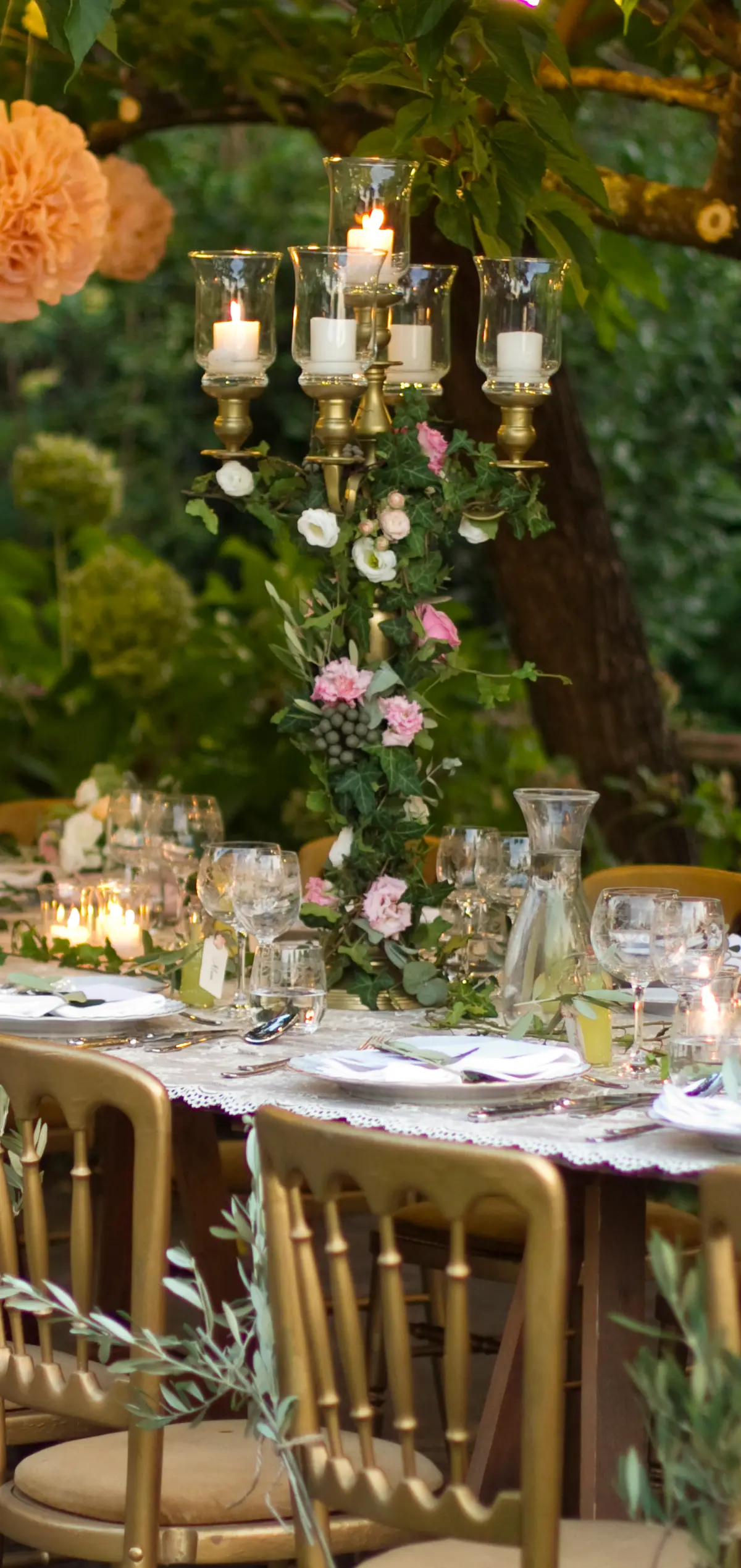 A garden reception under olive trees at Villa Michaela, Vorno, Lucca
