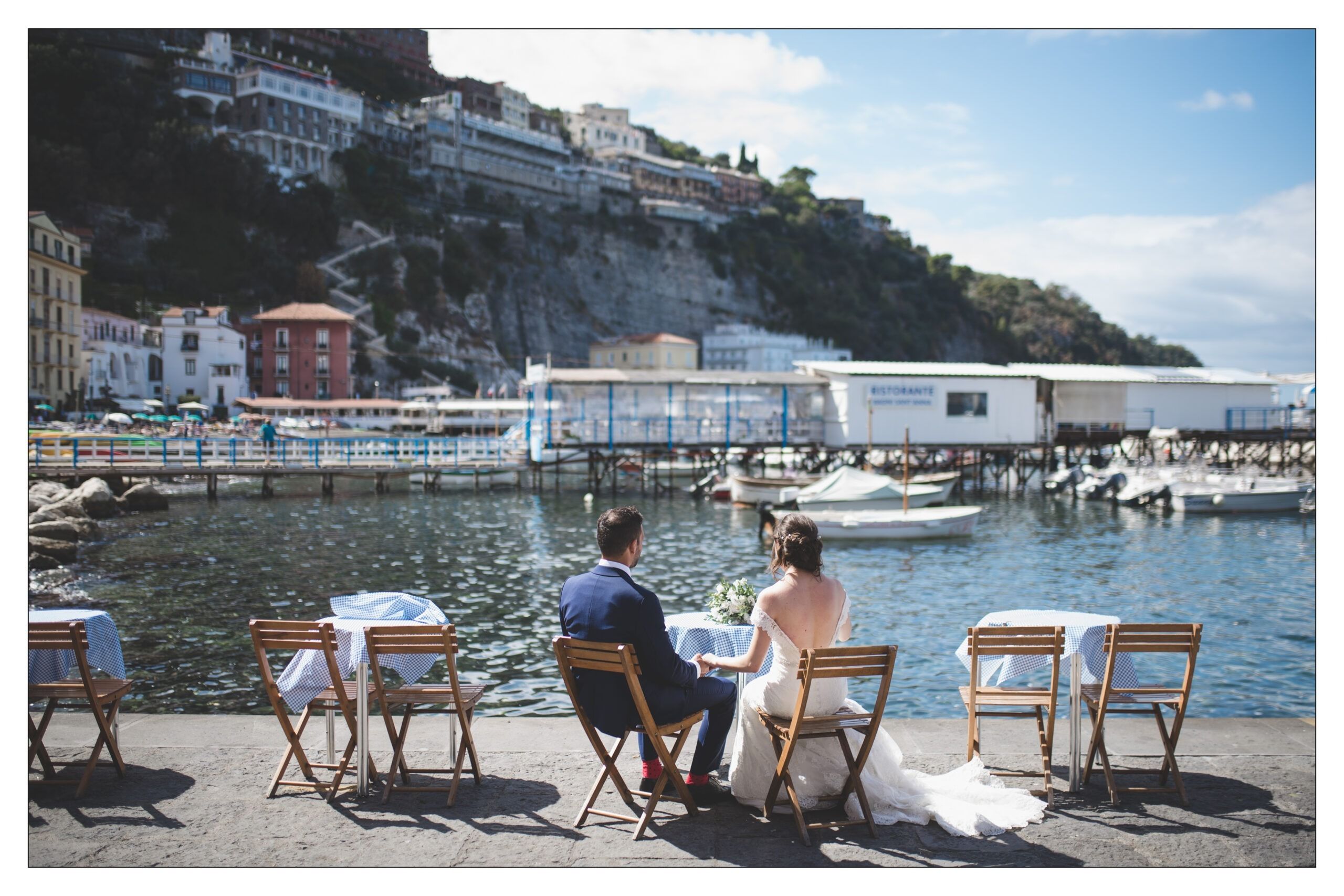 A bistro table at Marina Grande, Sorrento, the cliffside town banked above the harbour