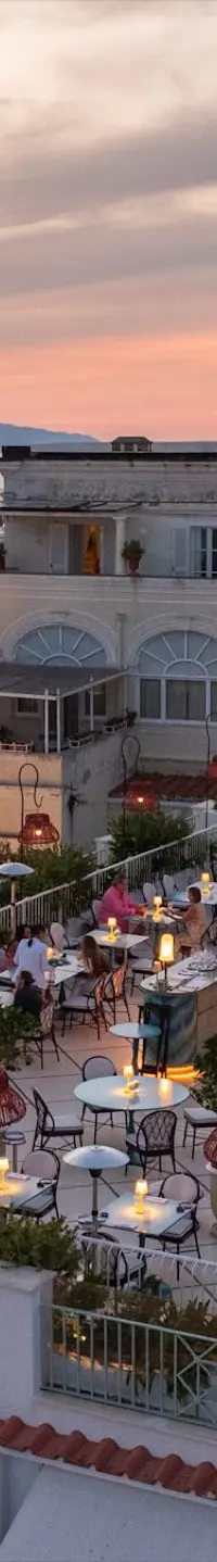 The rooftop at Hotel La Palma at sunset, over the rooftops of Capri
