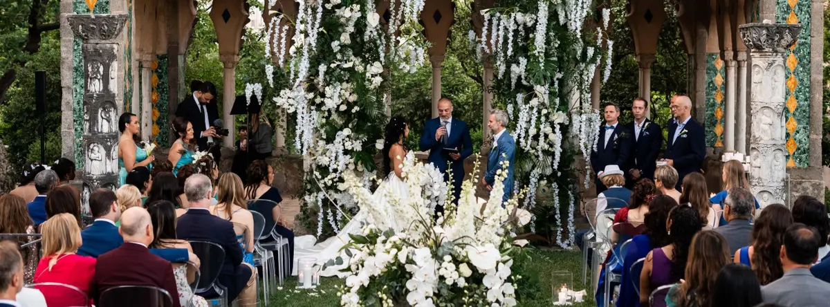 A symbolic ceremony beneath a white floral canopy, Villa Cimbrone, Ravello