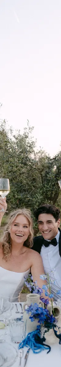 Couple toasting in the olive grove