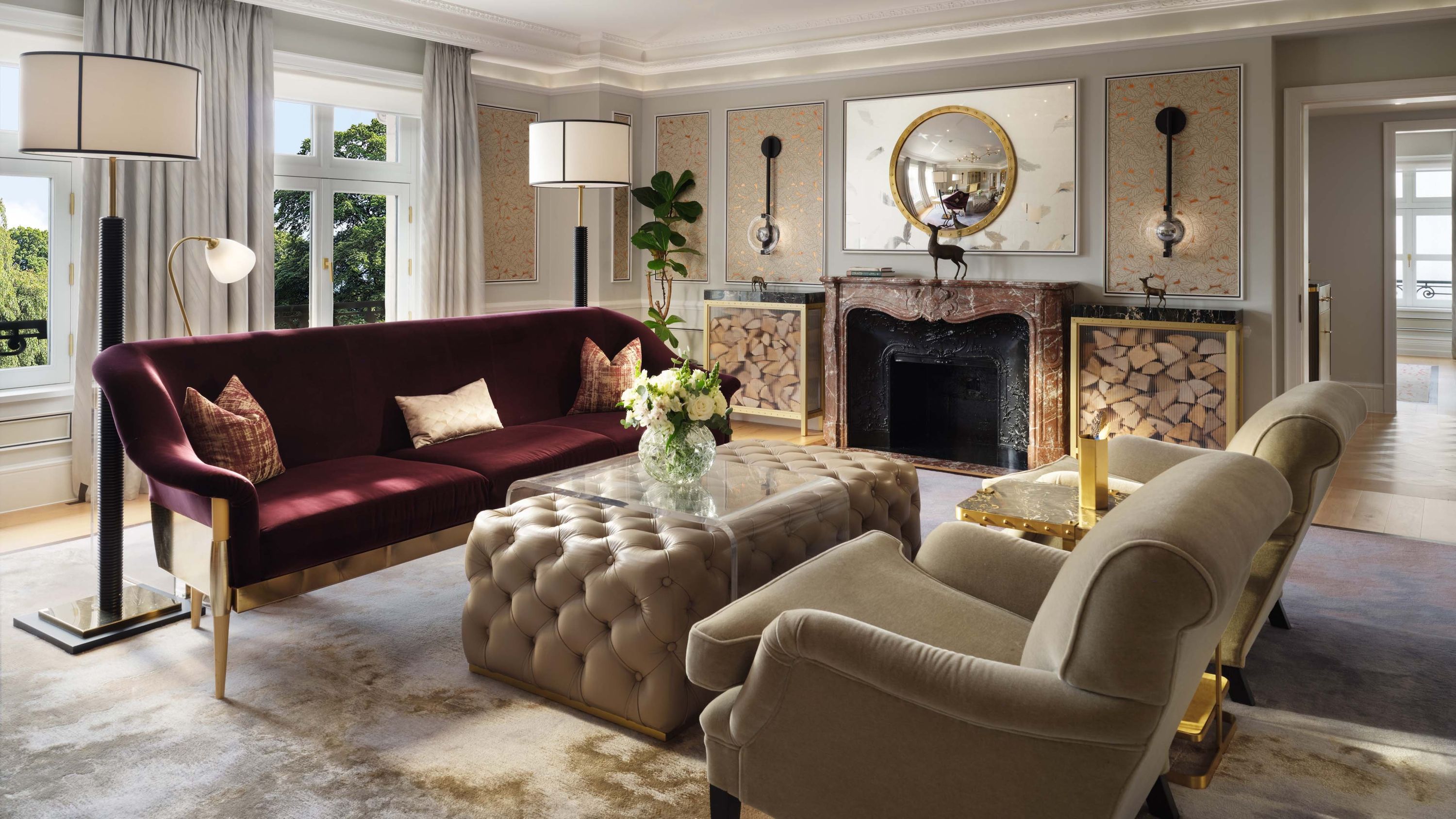 Suite lounge, tufted seating and a working fireplace