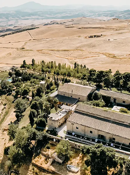 Aerial of the masseria among the golden farmland