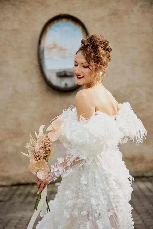 The vows, under an arch of white bloom