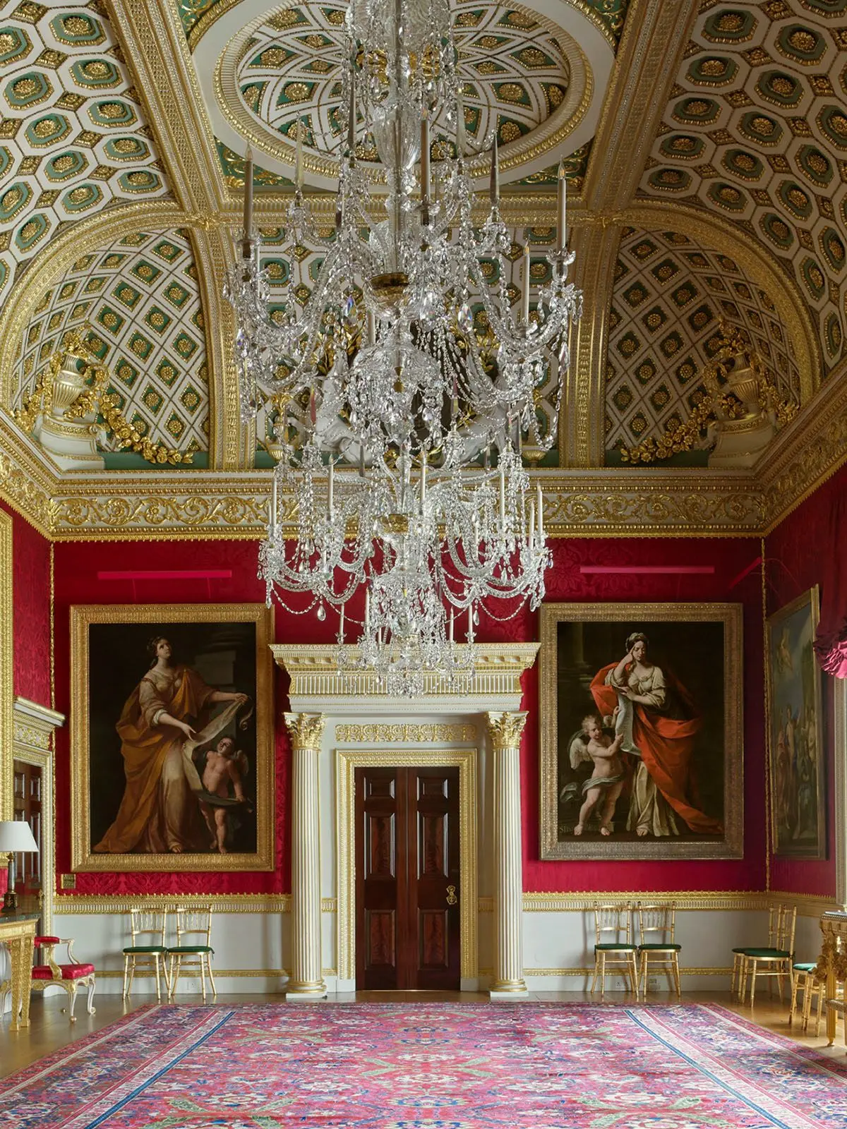 The Great Room, its walls hung in crimson silk beneath a coffered ceiling modelled on the Basilica of Maxentius in Rome, Spencer House, London, England