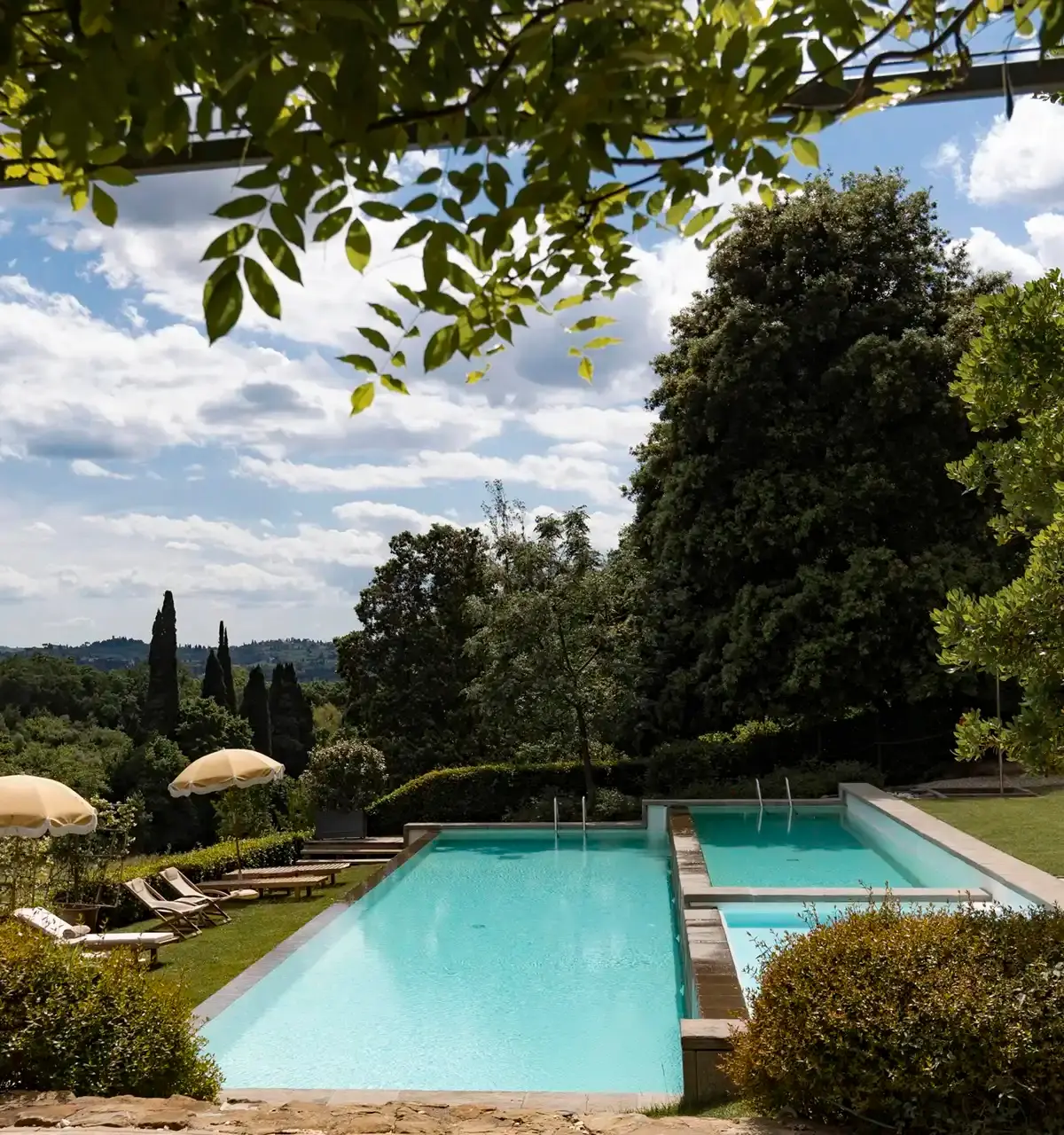 The infinity pool among cypress trees at Il Salviatino