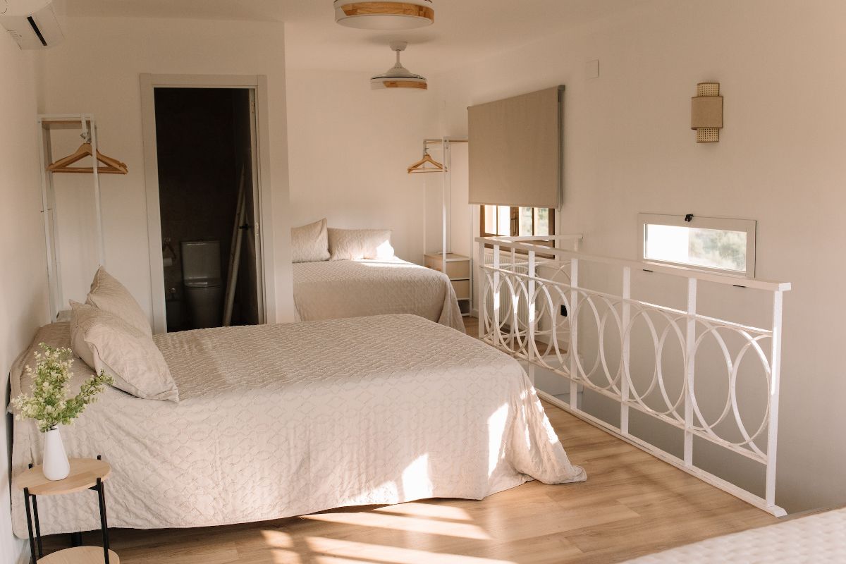 Bright bedroom with iron bed frame