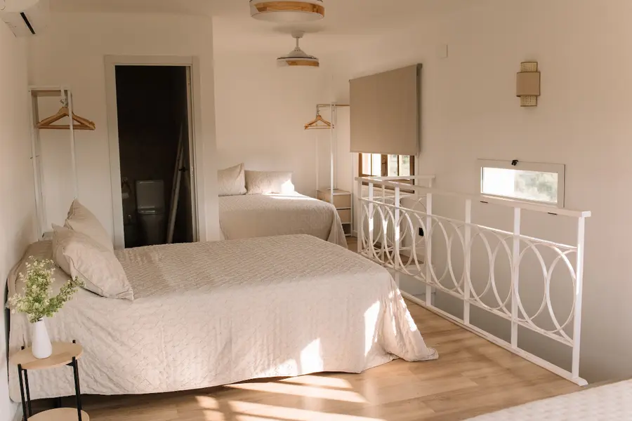Bright bedroom with iron bed frame