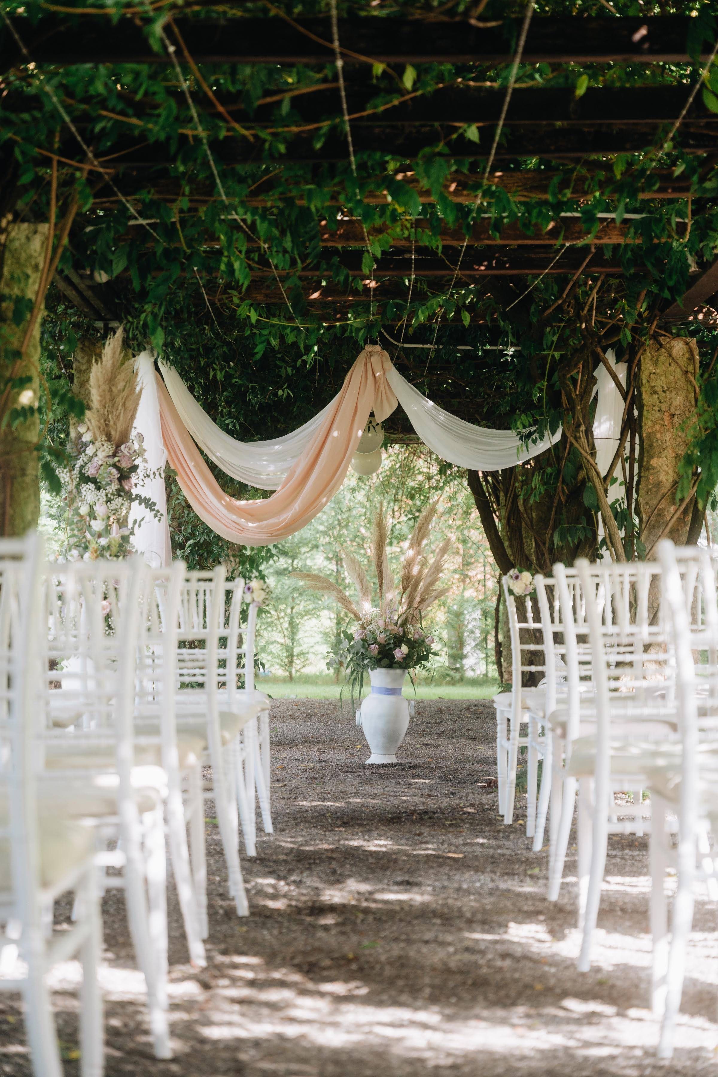 A ceremony pergola in a garden above Lake Como