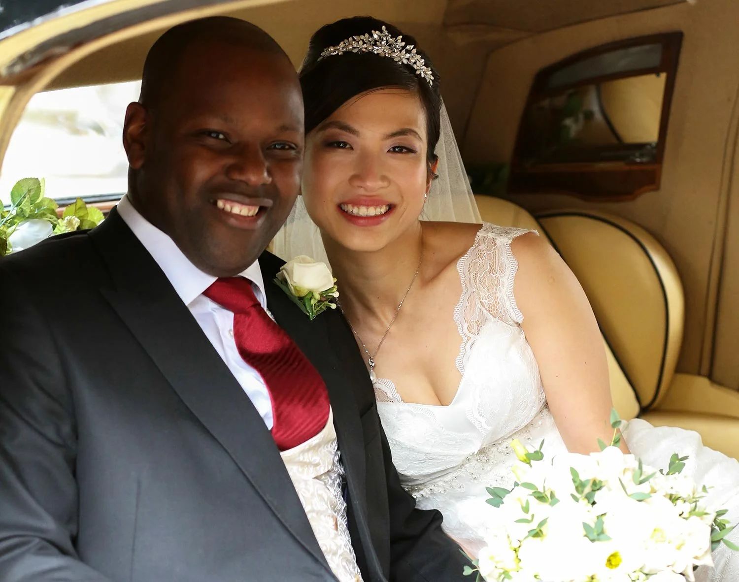A bride and groom together in the wedding car, Four Seasons Park Lane