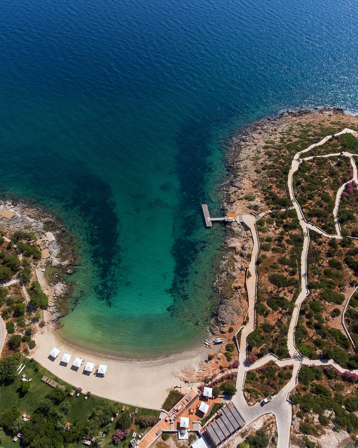 Aerial view of a rocky cove and headland along the coastline